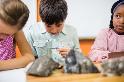 children-looking-fossils-with-a-magnifying-glass.jpg